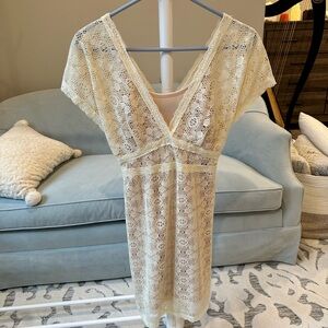 Cream colored lace overlay, short sleeve dress size small.